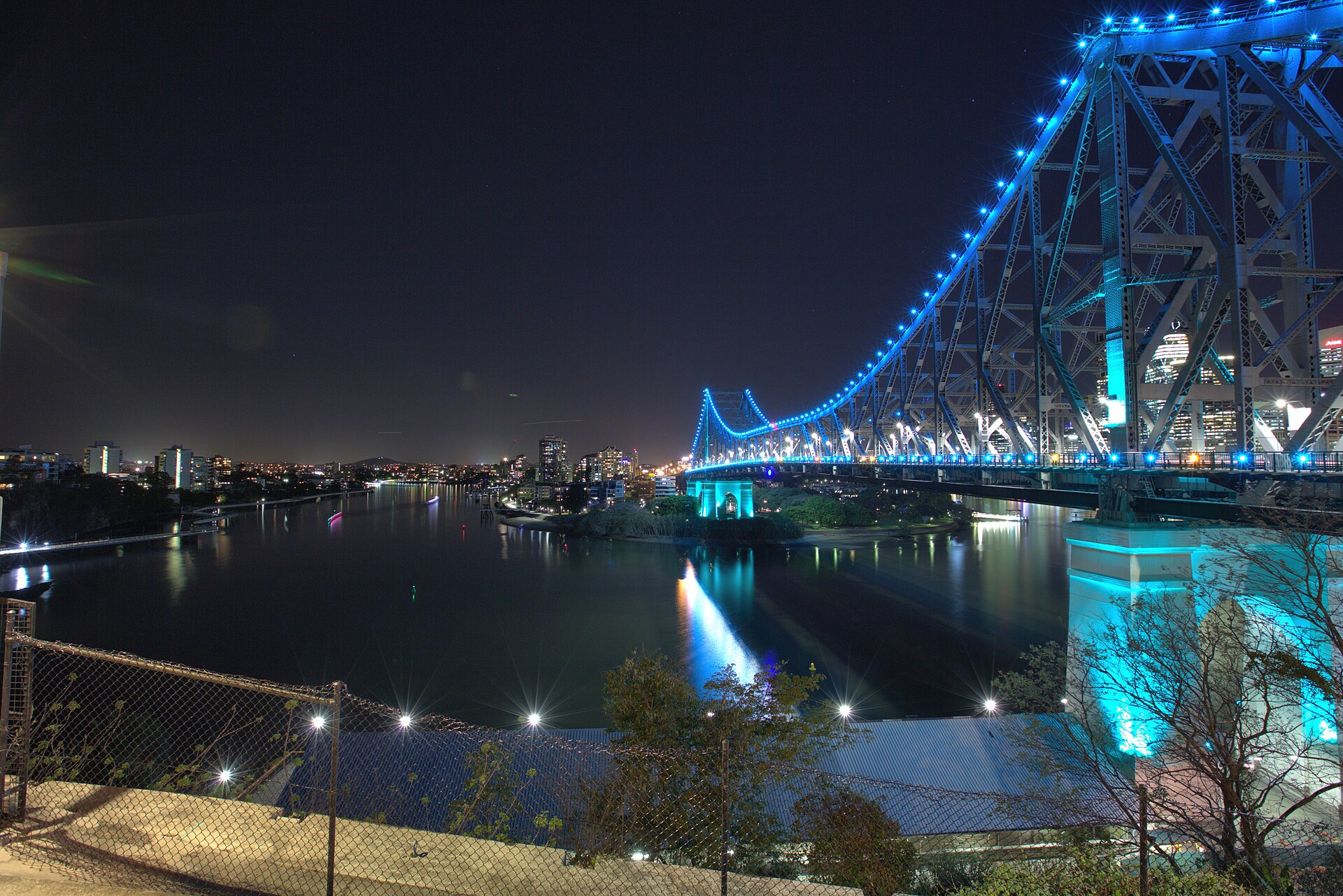 Brisbane Story Bridge illuminated over the Brisbane River at dusk